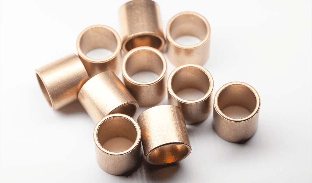 Sleeve Bronze Bearings Lay On A White Background